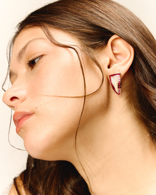Pyramid earring with ruby princess cut setting in a triangular shape with mother pearl as center piece.