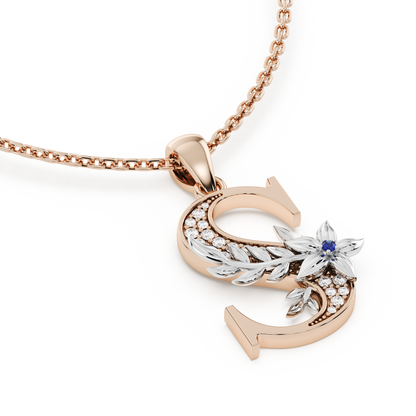 Handcrafted white gold letter S initial pendant from the Everbloom collection, set with diamonds and a rose gold floral motif featuring a round Blue sapphire gemstone.
