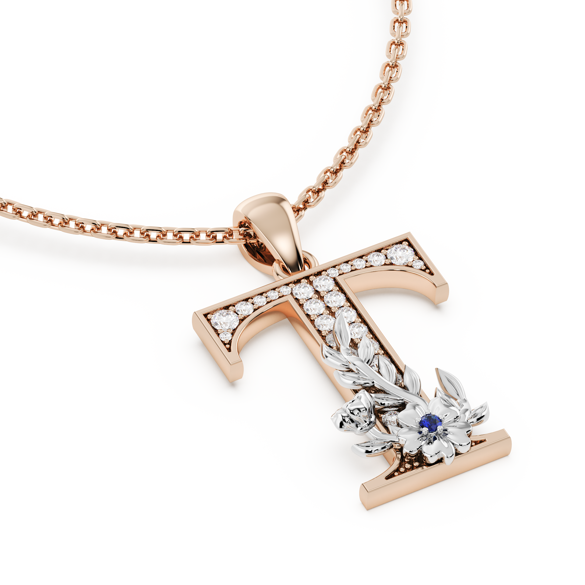 Handcrafted white gold letter T initial pendant from the Everbloom collection, set with diamonds and a rose gold floral motif featuring a round Blue sapphire gemstone.