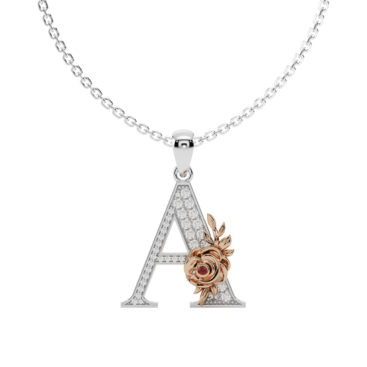 A hand-crafted white gold letter A pendant, entwined with a rose gold floral vine featuring pavé diamonds and a vivid gem quality ruby colour stone.