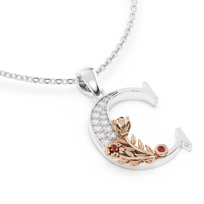 Handcrafted white gold letter C initial pendant from the Everbloom collection, set with diamonds and a rose gold floral motif featuring a round Ruby gemstone.